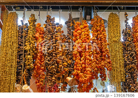 Dry vegetables hanging on a street market Dry vegetables hanging on a street market 139167606