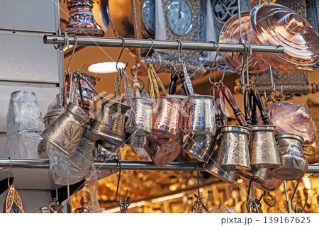 Retro coffee pots hanging on a market 139167625