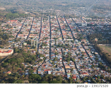 Birds eye view of a town with roads and buildings in daylight 139172320