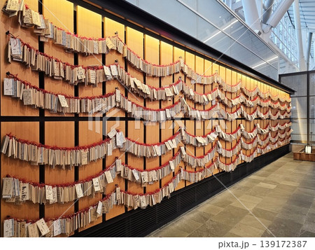 Large wall covered in ema at Haneda Airport in Tokyo, Japan. 139172387