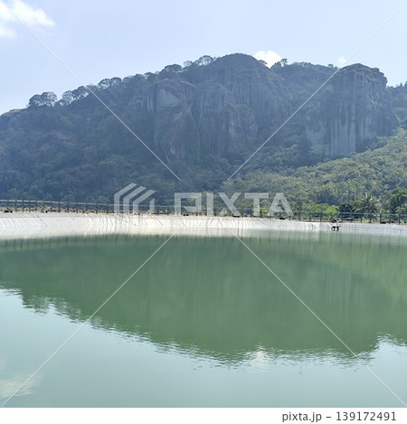 view of an artificial lake at the top of the hills with a cool atmosphere and beautiful views around it view of an artificial lake at the top of the hills with a cool atmosphere and beautiful views around it 139172491