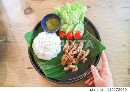grilled pork , pork steak or sliced pork and rice or pork and rice grilled pork , pork steak or sliced pork and rice or pork and rice 139172980