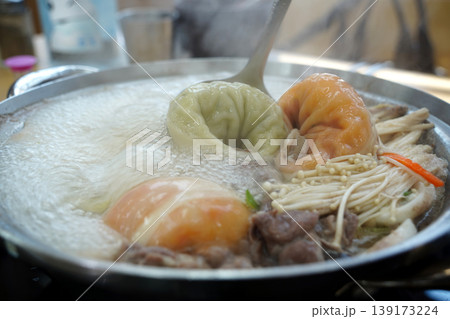 Boiling Korean Dumpling Hot Pot with Various Mandu and Mushrooms, Mandu-jeongol Boiling Korean Dumpling Hot Pot with Various Mandu and Mushrooms, Mandu-jeongol 139173224