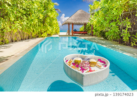Radiant luxury tourism background summer travel couple honeymoon private pool floating breakfast tropical beach resort palm trees ocean view relaxing romantic vacation exotic villa leisure 139174023