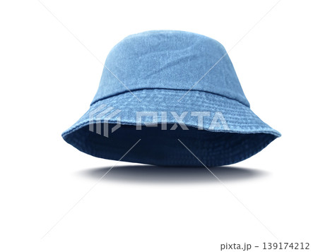 A blue fabric bucket hat against a white background. A blue fabric bucket hat against a white background. 139174212