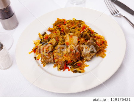 Appetizing cabbage stewed with pork meat on plate Appetizing cabbage stewed with pork meat on plate 139176421