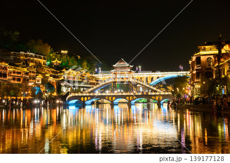 Fenghuang Ancient Town. Located in Fenghuang County. Southwest of HuNan Province, China. Fenghuang is a popular tourist destination of Asia. Fenghuang Ancient Town. Located in Fenghuang County. Southwest of HuNan Province, China. Fenghuang is a popular tourist destination of Asia. 139177128