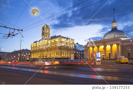 Facade historic building of the Leningradsky railway station (written in Russian)  night, with the super moon -- is one of the nine main railway stations of Moscow, Russia 139177253