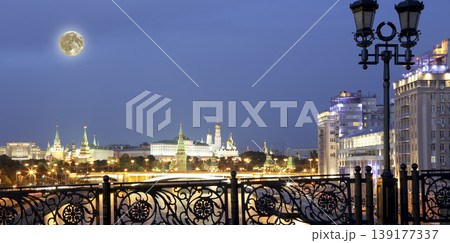 Night view of the Moskva River, the Great Stone Bridge and the Kremlin, with the moon, Moscow, Russia. Variety Theatre-- written in Russian 139177337