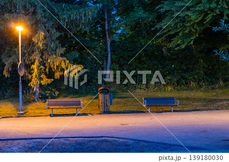 Evening Park Scene with Benches and Streetlight Evening Park Scene with Benches and Streetlight 139180030