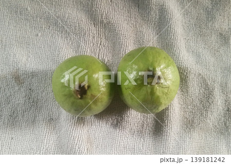 Two Fresh Guava Fruits on White Background Two Fresh Guava Fruits on White Background 139181242