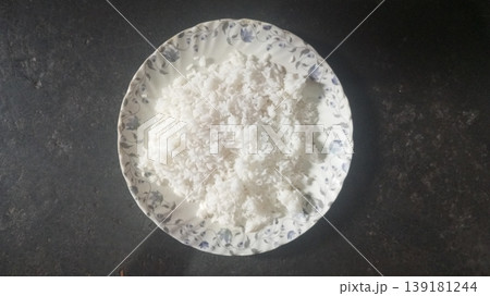 Fluffy Cooked White Rice on Patterned Ceramic Plate 139181244