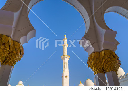 Abu Dhabi, United Arab Emirates - Jan 10 2024, Bottom-up view of the minaret of the Grand Mosque of Sheikh Zayed, in the daytime, Abu Dhabi, United Arab Emirates Abu Dhabi, United Arab Emirates - Jan 10 2024, Bottom-up view of the minaret of the Grand Mosque of Sheikh Zayed, in the daytime, Abu Dhabi, United Arab Emirates 139183034