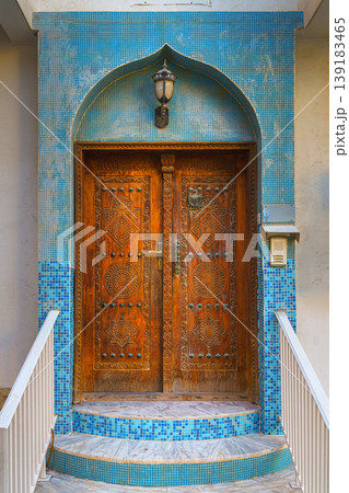 Manama, Bahrain - Jan 08 2024, Close up view of an old vintage wooden door on one of the streets of Manama, Bahrain Manama, Bahrain - Jan 08 2024, Close up view of an old vintage wooden door on one of the streets of Manama, Bahrain 139183465