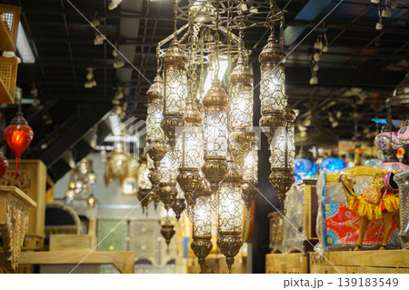 Manama, Bahrain - Jan 08 2024, View of a large bright antique chandelier consisting of many lanterns in one of the souvenir shops of Bab Al Bahrain, Manama, Bahrain Manama, Bahrain - Jan 08 2024, View of a large bright antique chandelier consisting of many lanterns in one of the souvenir shops of Bab Al Bahrain, Manama, Bahrain 139183549
