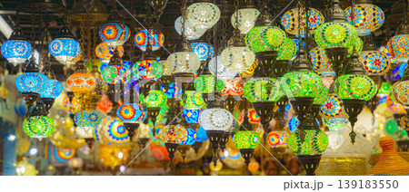 Manama, Bahrain - Jan 08 2024, A view from below of a variety of many colorful vintage Arabic and Persian lamps and chandeliers, Fanoos, Manama, Bahrain 139183550