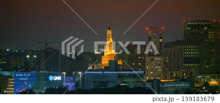 Doha, Qatar - Jan 07 2024, Panoramic view of the city, a park in the foreground, the Islamic cultural center Abdulah Bin Al Mahmoud is captured in the center of the frame, at evening, Doha, Qatar Doha, Qatar - Jan 07 2024, Panoramic view of the city, a park in the foreground, the Islamic cultural center Abdulah Bin Al Mahmoud is captured in the center of the frame, at evening, Doha, Qatar 139183679