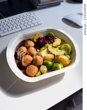 Swedish meatball meal with potato and Brussels sprout served in a takeaway container. Comfort food, fast lunch, convenience, and casual dining experience 139184090