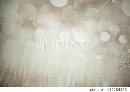 Soft bokeh background with blurred lights creating a dreamy atmosphere, ideal for design projects, invitations, or holiday themes, featuring warm tones and gentle textures 139184326