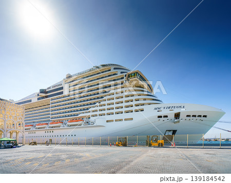 Doha, Qatar - Jan 07 2024, a panoramic view of the MSC Virtuosa cruise ship moored in the port of Doha, in the daytime with the bright sun, Doha, Qatar Doha, Qatar - Jan 07 2024, a panoramic view of the MSC Virtuosa cruise ship moored in the port of Doha, in the daytime with the bright sun, Doha, Qatar 139184542
