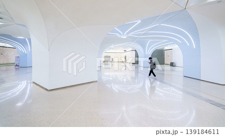 Doha, Qatar - Jan 06 2024, a panoramic view of white walls of Doha metro station hall, with some people in it, Doha, Qatar 139184611