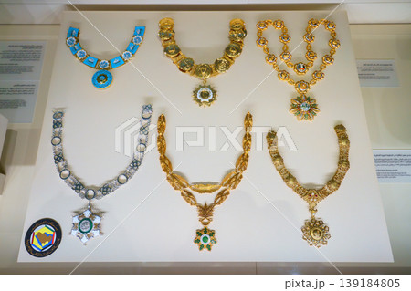 Doha, Qatar - Jan 06 2024, a close up view of historical vintage royal jewellery, six necklaces, exhibits of National Museum of Qatar, on monochrome background, under the glass, Doha, Qatar Doha, Qatar - Jan 06 2024, a close up view of historical vintage royal jewellery, six necklaces, exhibits of National Museum of Qatar, on monochrome background, under the glass, Doha, Qatar 139184805