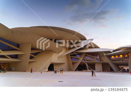 Doha, Qatar - Jan 06 2024, a panoramic view of National Museum of Qatar courtyard, patio, with some people in it, in shape of desert rose, at evening, Doha, Qatar Doha, Qatar - Jan 06 2024, a panoramic view of National Museum of Qatar courtyard, patio, with some people in it, in shape of desert rose, at evening, Doha, Qatar 139184875