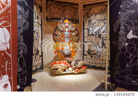 Doha, Qatar - Jan 06 2024, A view of the tapestry with various patterns and drawings, in the middle is a round painting with a skeleton, the history of coffee, National Museum of Qatar, Doha, Qatar Doha, Qatar - Jan 06 2024, A view of the tapestry with various patterns and drawings, in the middle is a round painting with a skeleton, the history of coffee, National Museum of Qatar, Doha, Qatar 139184878