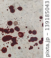 Reddish brown Blood Splatters Across Concrete Surface with Dark Spots Reflecting Brutality and Urgency 139185043