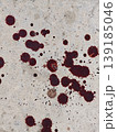 Red Blood Splatters Spread Across a Weathered Concrete Surface High Contrast Emotional Impact on Commercial Advertisements 139185046