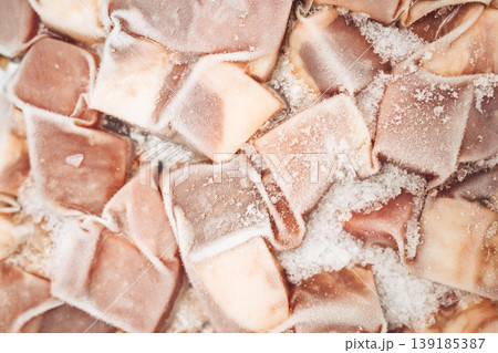 Close-up of frozen food packs with ice crystals on a cold surface Close-up of frozen food packs with ice crystals on a cold surface 139185387
