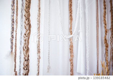 Textured wall display featuring various braided materials in neutral tones, showcasing intricate craftsmanship and design elements, ideal for home decor inspiration and artistic expression Textured wall display featuring various braided materials in neutral tones, showcasing intricate craftsmanship and design elements, ideal for home decor inspiration and artistic expression 139185482