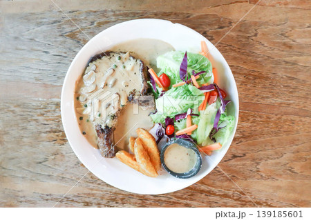 pork steak or grilled pork and salad or pork chop and vegetable pork steak or grilled pork and salad or pork chop and vegetable 139185601