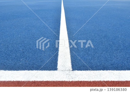 white line on blue with brown football artificial turf texture and background 139186380