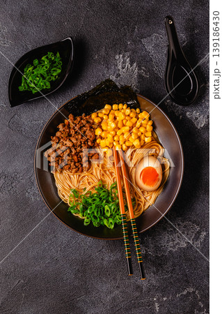 A bowl of ramen with noodles, meat and green onions. A bowl of ramen with noodles, meat and green onions. 139186430