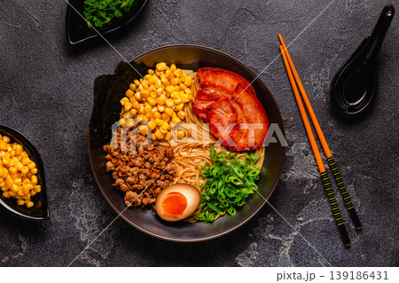 A bowl of ramen with noodles, meat and green onions. A bowl of ramen with noodles, meat and green onions. 139186431