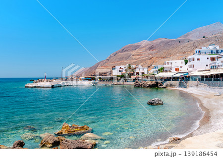 Beautiful coastal view of white buildings along a serene bay 139186454