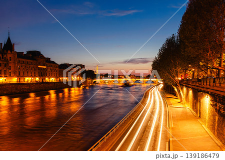 View of Paris by night with the Seine river and the Conciergerie building View of Paris by night with the Seine river and the Conciergerie building 139186479