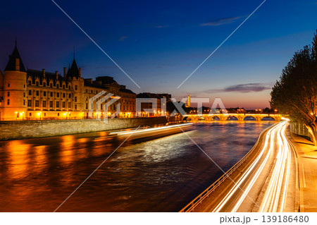 View of Paris by night with the Seine river and the Conciergerie building View of Paris by night with the Seine river and the Conciergerie building 139186480