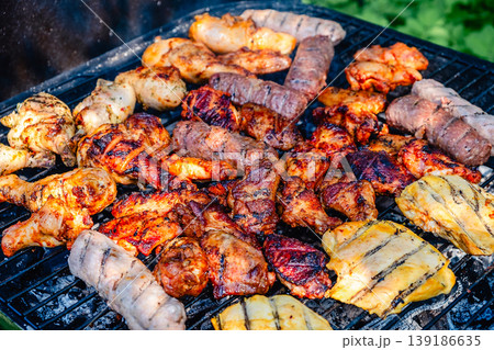 grilled meat over the coals on barbecue grilled meat over the coals on barbecue 139186635