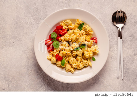 pasta in a plate with tomato sauce. pasta in a plate with tomato sauce. 139186643