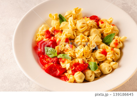pasta in a plate with tomato sauce. pasta in a plate with tomato sauce. 139186645