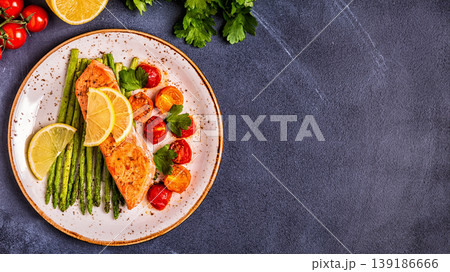 Grilled salmon with asparagus and tomatoes. Grilled salmon with asparagus and tomatoes. 139186666