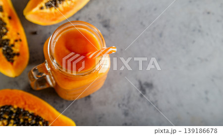 Papaya smoothie, selective focus. Detox, diet food. Papaya smoothie, selective focus. Detox, diet food. 139186678