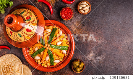 Vegetable tagine with almond and chickpea couscous Vegetable tagine with almond and chickpea couscous 139186681