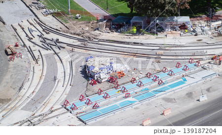 Road construction site with tram tracks repair and maintenance aerial timelapse. Road construction site with tram tracks repair and maintenance aerial timelapse. 139187204