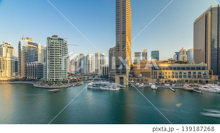 Aerial vew of Dubai Marina with shoping mall, restaurants, towers and yachts timelapse, United Arab Emirates. 139187268