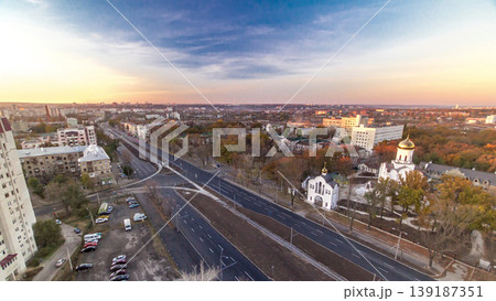 Aerial vivid colorful sunset view with road traffic skyscape timelapse. Kharkiv city from above Aerial vivid colorful sunset view with road traffic skyscape timelapse. Kharkiv city from above 139187351