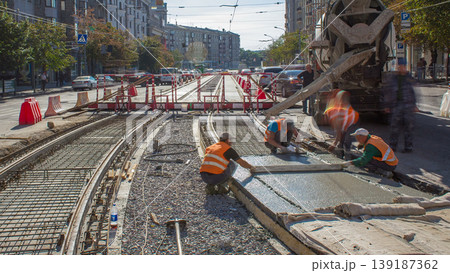 Concrete works for road maintenance construction with many workers and mixer machine timelapse Concrete works for road maintenance construction with many workers and mixer machine timelapse 139187362