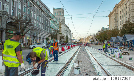 Tram rails at the stage of their installation and integration into concrete plates on the road timelapse. Tram rails at the stage of their installation and integration into concrete plates on the road timelapse. 139187367